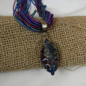 Multi-colored Seed Bead Necklace with Blue Artisan Pendant